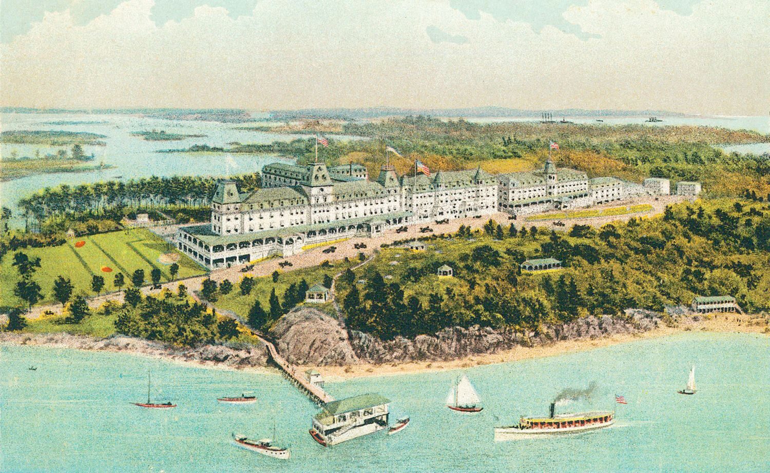 Vintage color postcard of the grand Wentworth by the Sea hotel above a harbor dotted with sailboats and a steamship